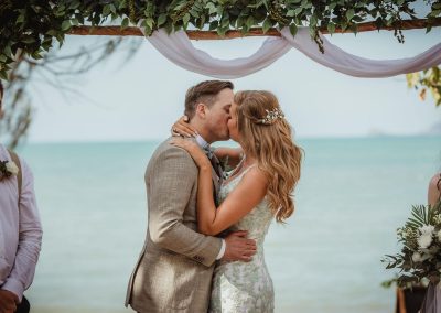 Bride and Groom first kiss during wedding ceremony at Paradise Cove Resort