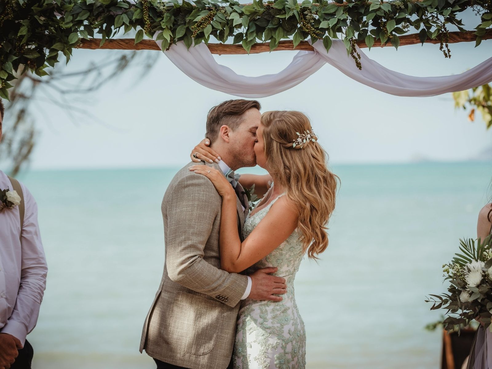 Bride and Groom first kiss during wedding ceremony at Paradise Cove Resort