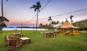One example of how the beachfront lawn can be setup to hold unique and affordable weddings at Villa Paradise Cove in Airlie Beach, Whitsundays.
